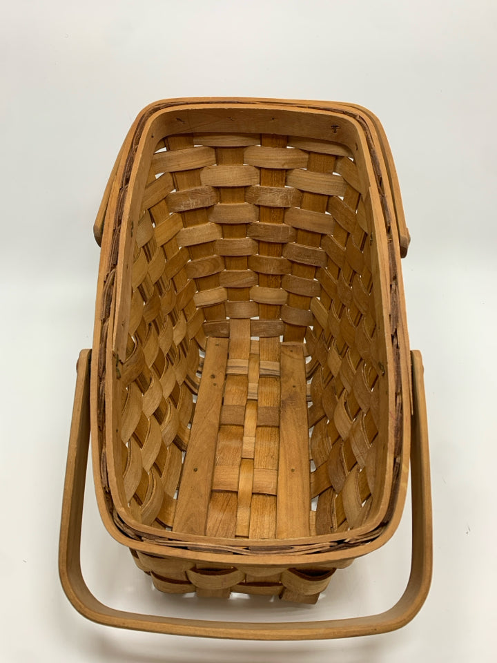 SLANTED WICKER BASKET W/HANDLES.
