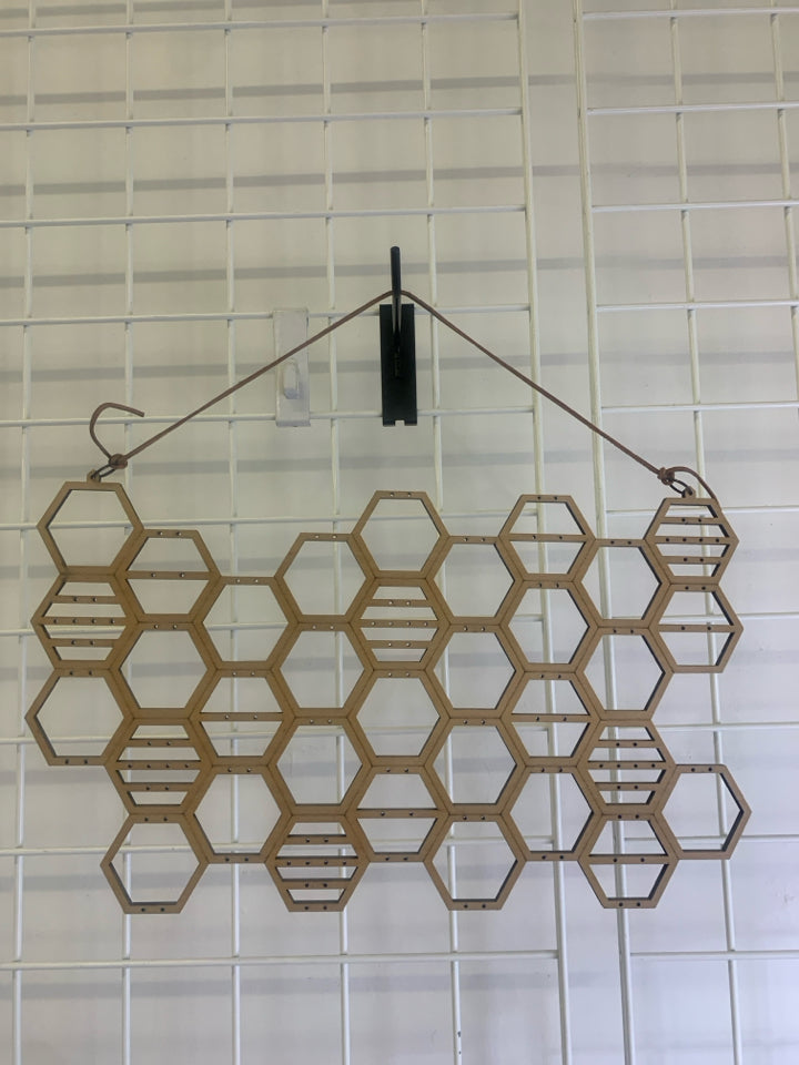 WOOD HONEY COMB JEWELRY HOLDER.