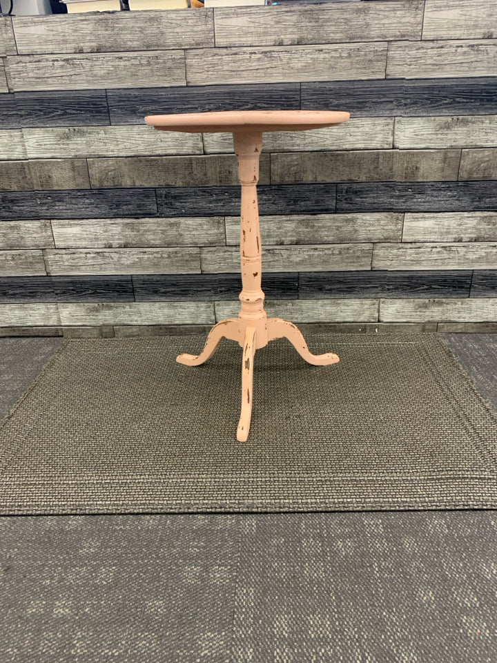 DISTRESSED PEACH AND WOOD ROUND SIDE TABLE.