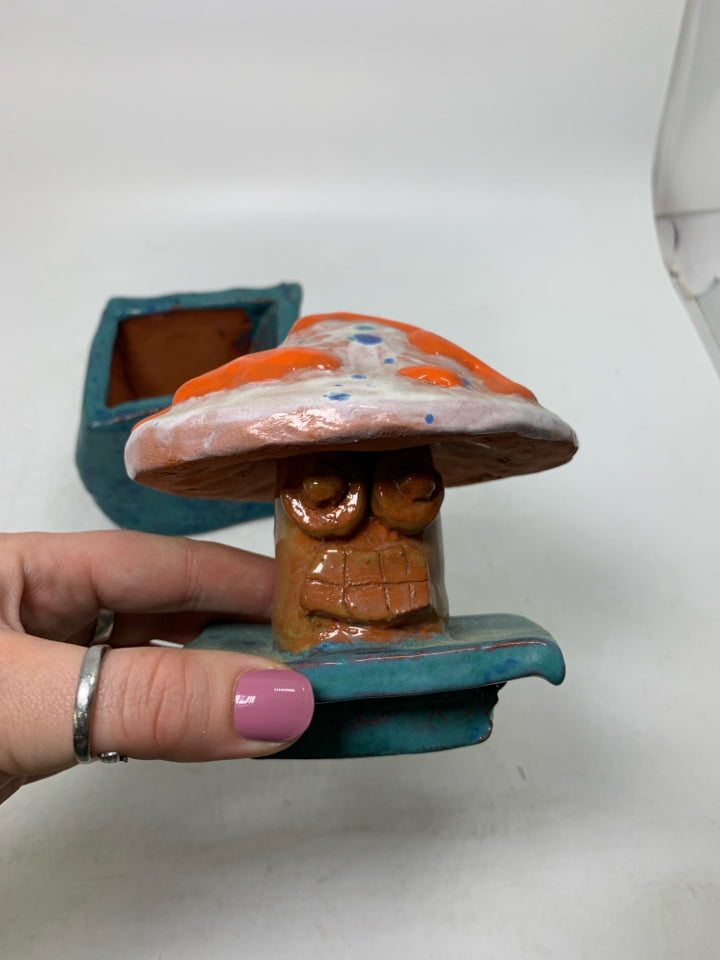 HOME MADE BLUE CANISTER W/ MUSHROOM TOP.