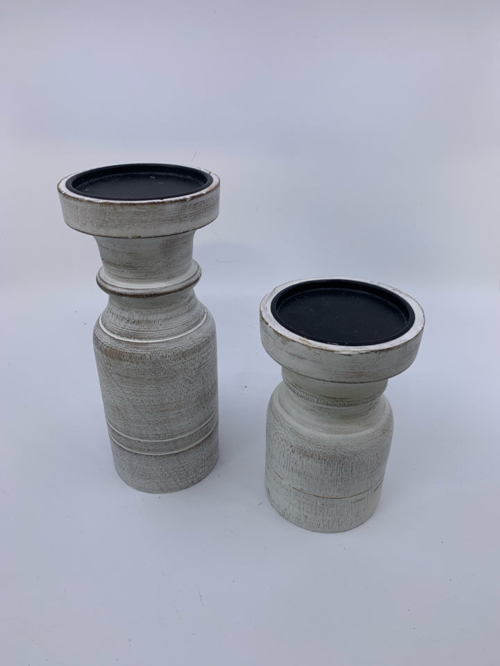 2 PILLAR CANDLE HOLDERS DISTRESSED WHITE.