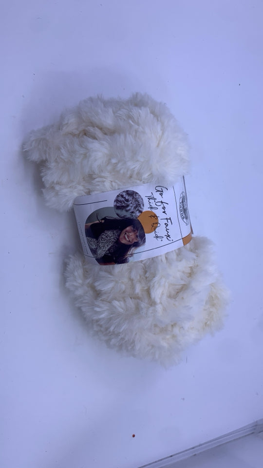 FUZZY CREAM YARN.