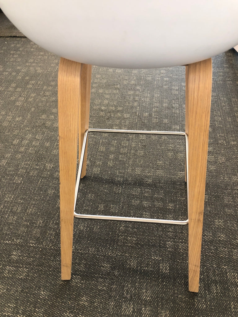 WHITE STOOL CONTEMPORARY W/BLOND WOOD LEGS & WIRE REINFORCED.