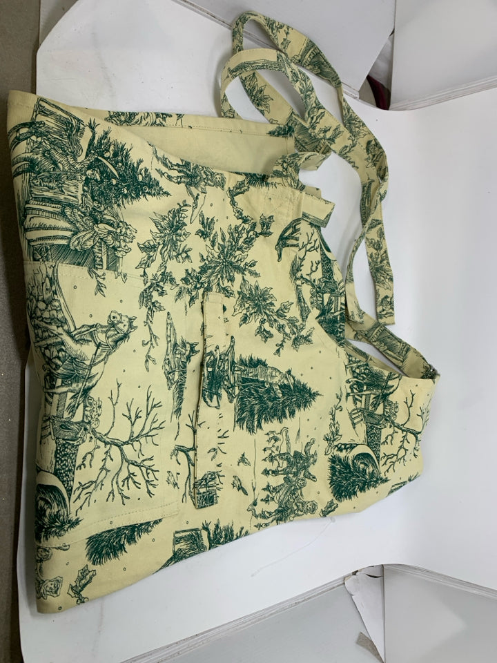 CREAM BIB APRON W/ VINTAGE LOOK CHRISTMAS THEME.