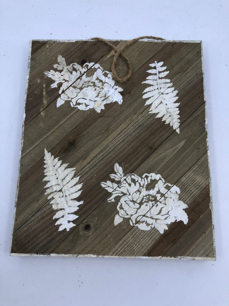 WOOD SIGN WITH WHITE PAINTED LEAVES/FLOWERS.