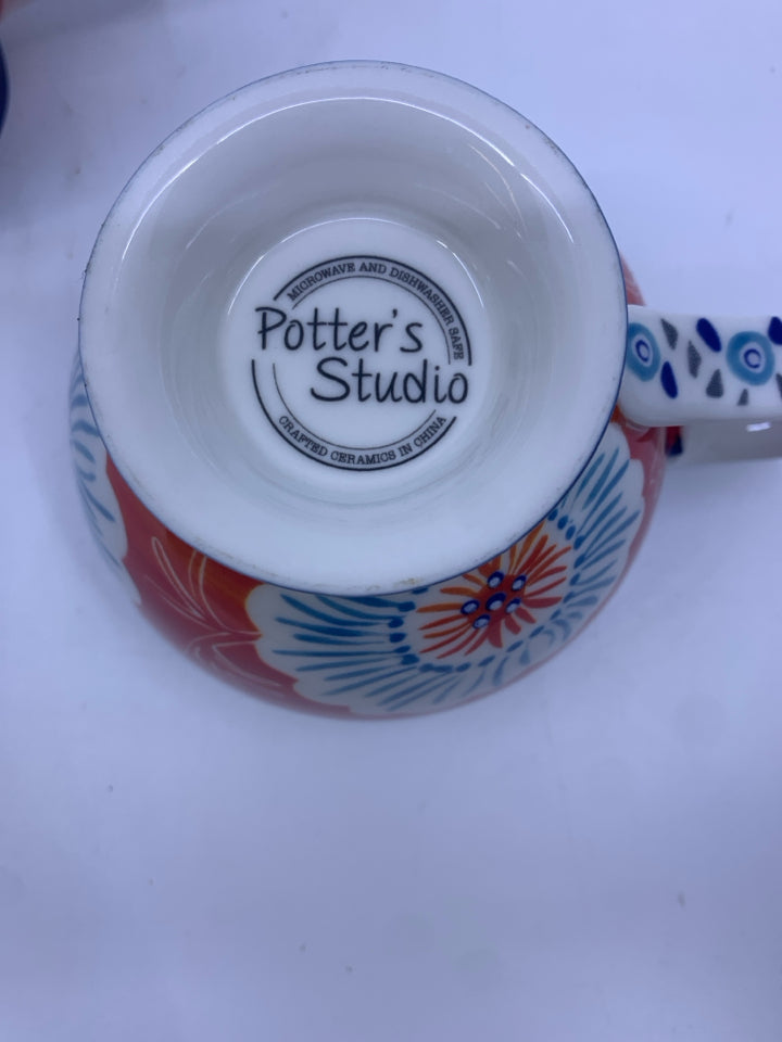 2 POTTERY STUDIO FLORAL MUGS.