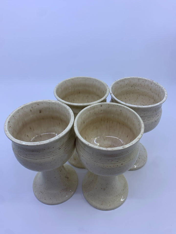 4 CREAM W/ SPECKLES POTTERY GOBLETS.