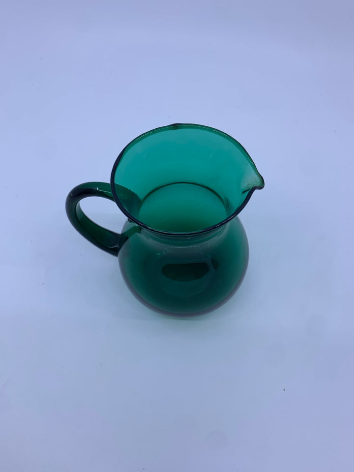 SMALL LIGHT GREEN GLASS PITCHER.