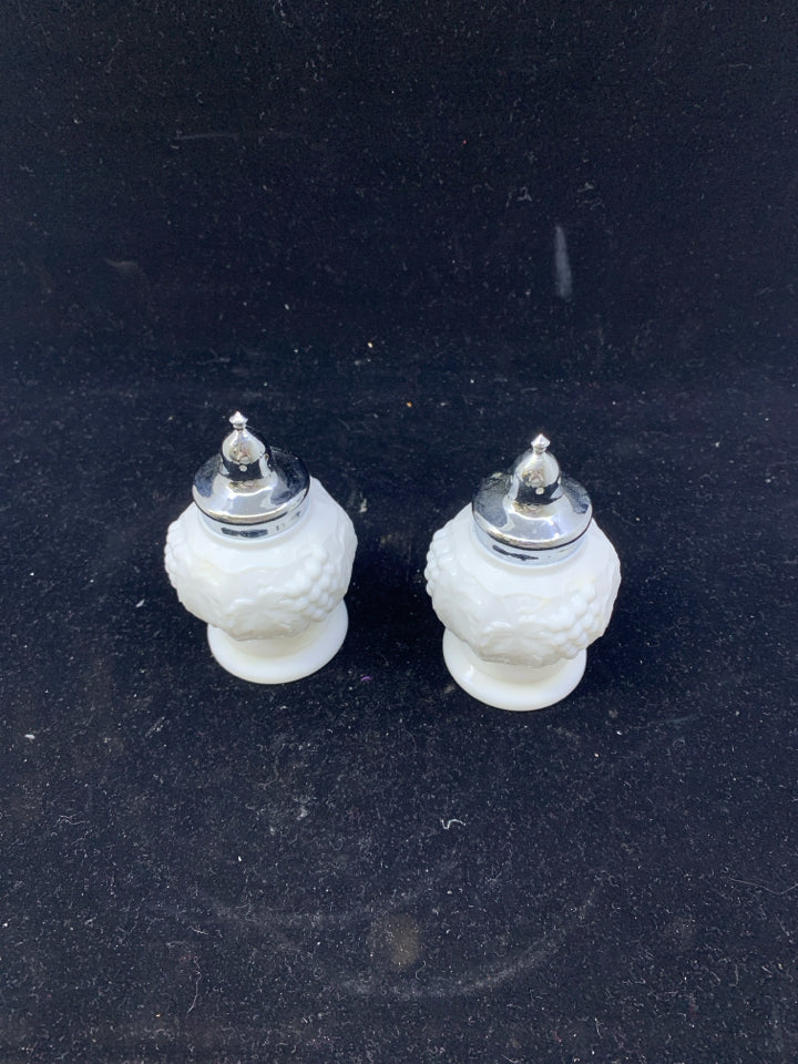 2 VTG MILK GLASS EMBOSSED SALT AND PEPPER SHAKERS.