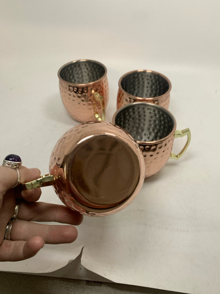 4 COPPER COLORED HAMMERED MOSCOW MULE MUGS.