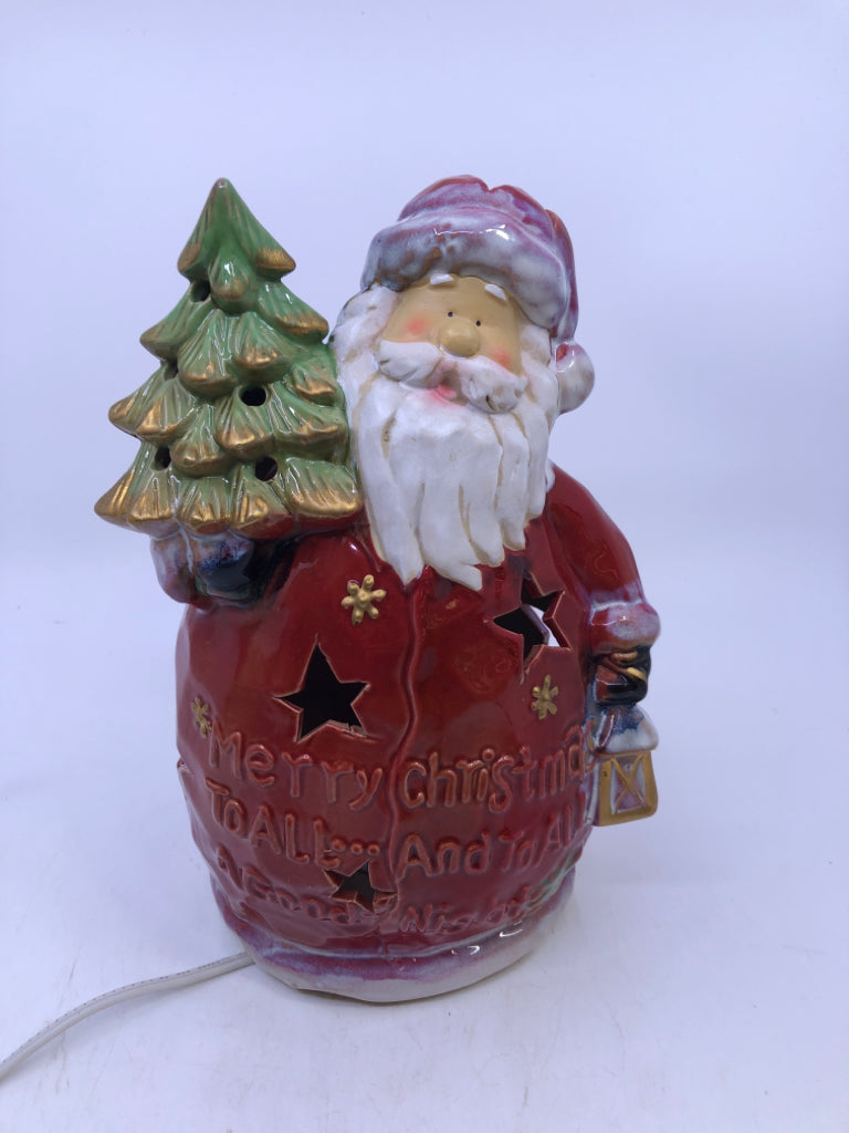RED CERAMIC LIGHT UP SANTA HOLDING A TREE.