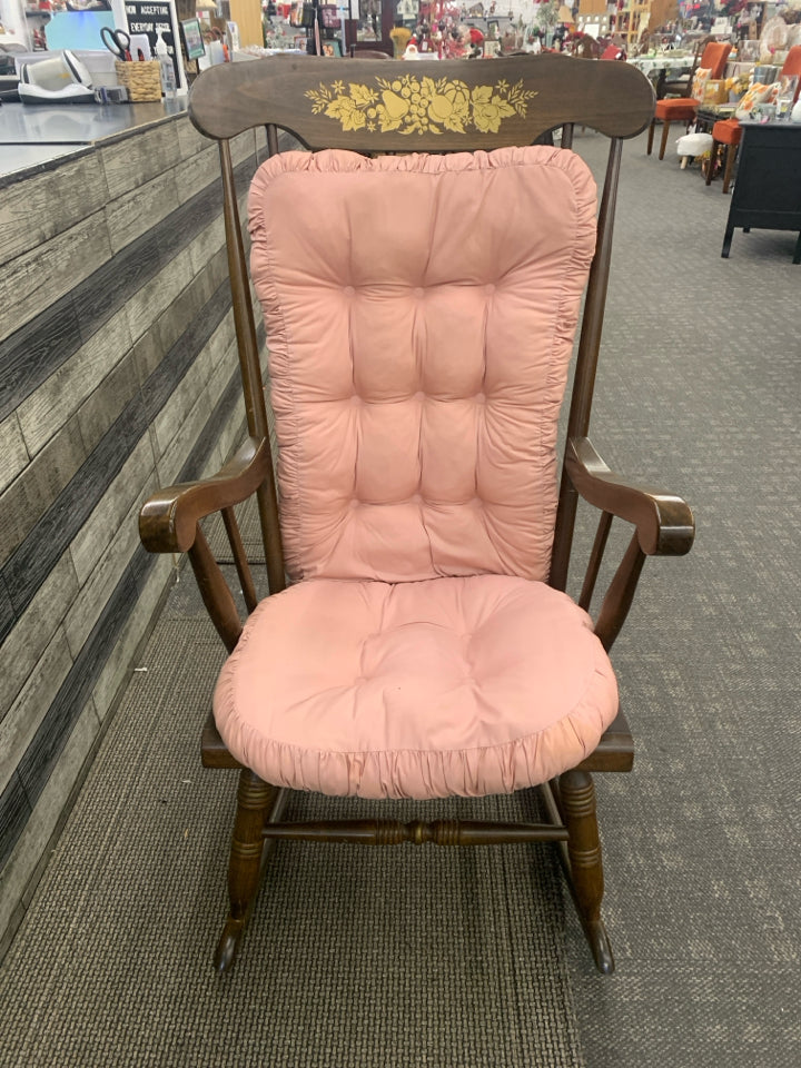 MEDIUM WOOD ROCKING CHAIR WITH GOLD FLOWER DESIGN.