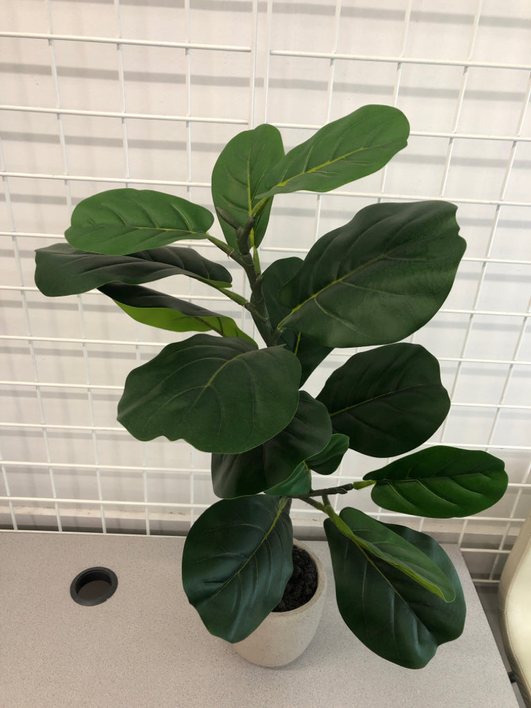 LARGE LEAF FAUX PLANT IN CONCRETE POT.