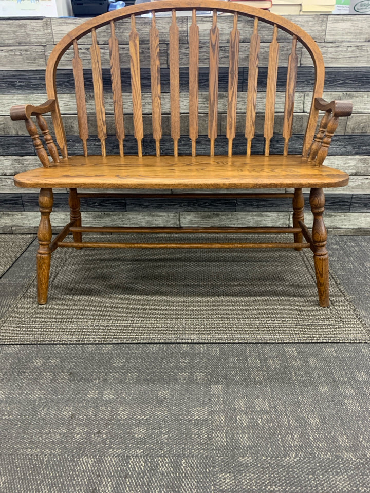 VTG DARK WOOD ROUND BACK BENCH.