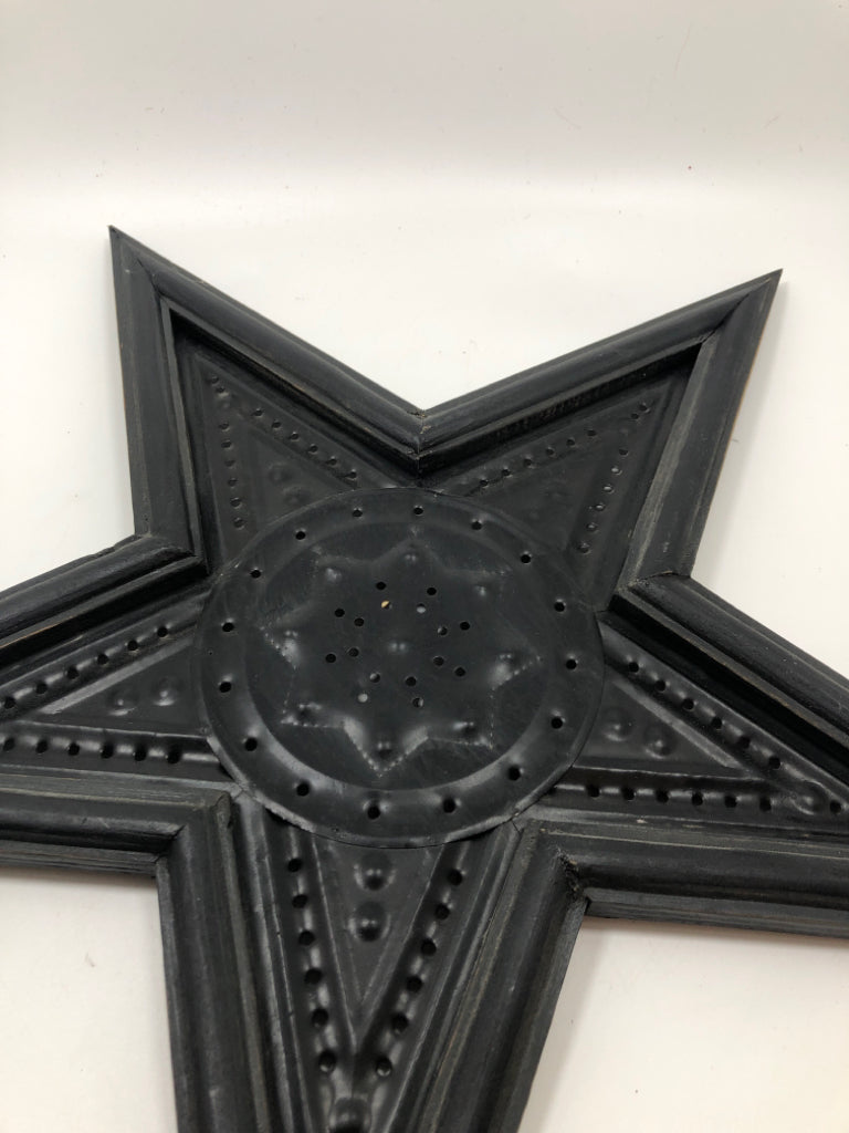 METAL PUNCHED STAR WALL DECOR.