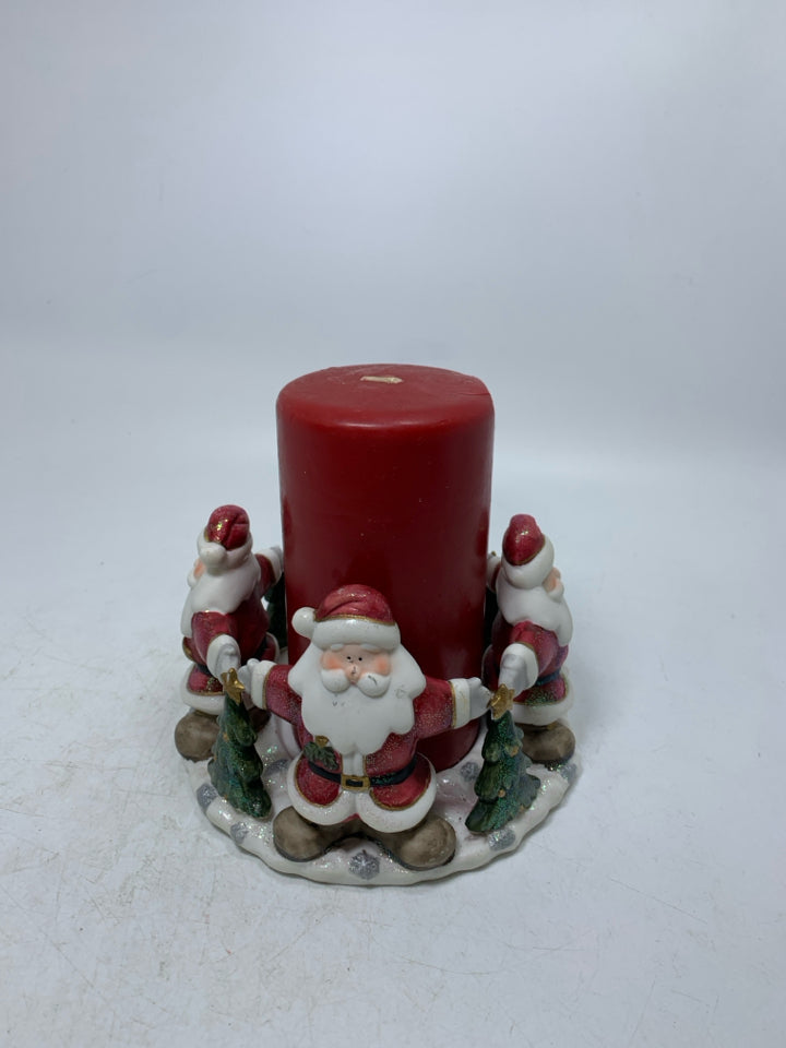 CERAMIC SANTA TOUCHING HANDS BASE W/ RED PILLAR CANDLE.
