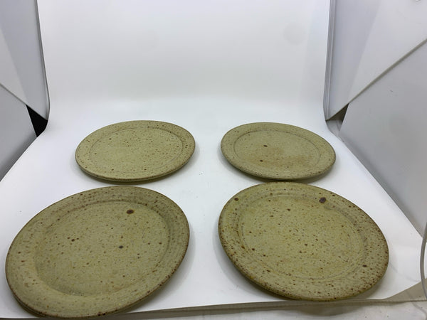 4 TAN SPECKLED POTTERY PLATES.