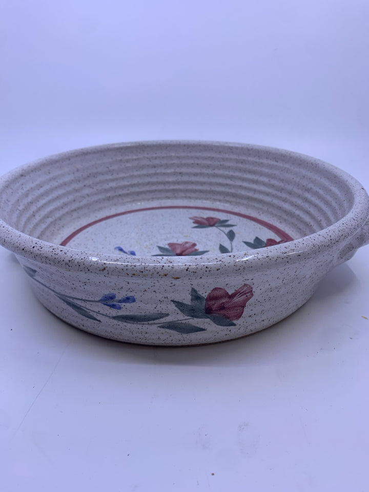 PINK FLOWER POTTERY BOWL WITH TWISTED HANDLES.