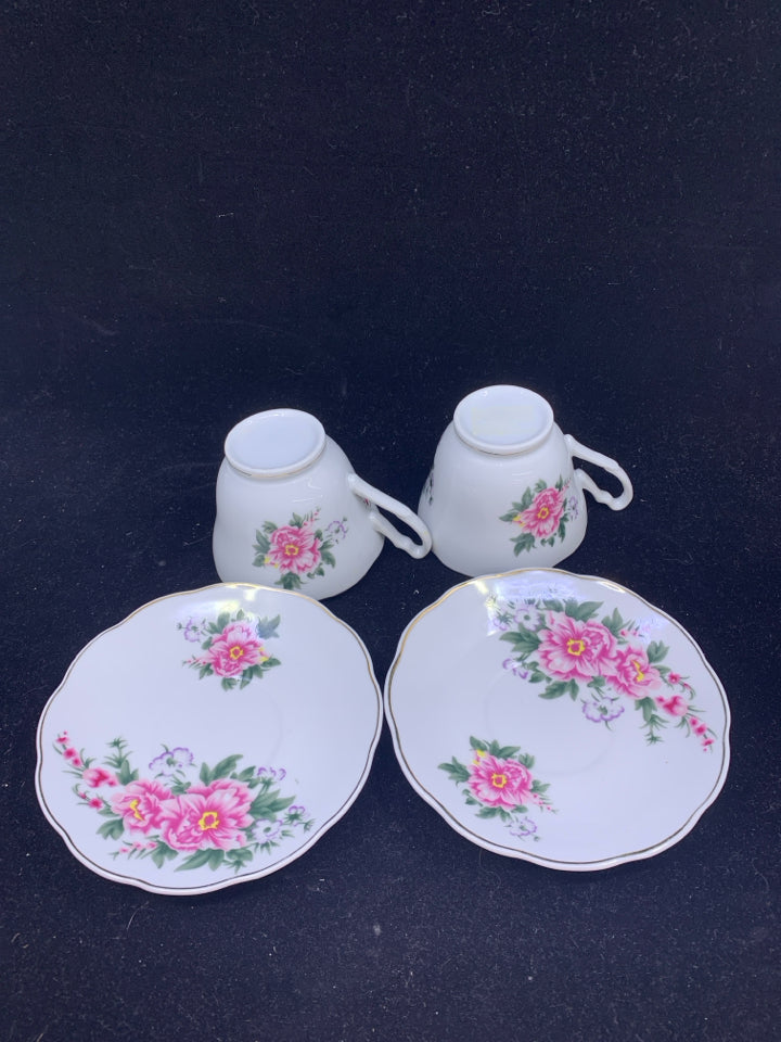 2 TEA CUPS AND SAUCERS WITH PINK FLOWERS AND GOLD RIM.