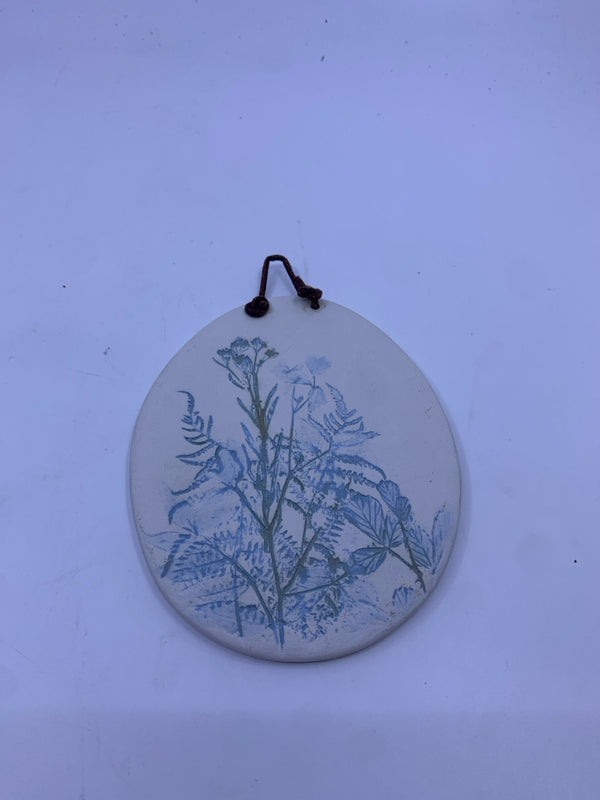BLUE AND GREEN WILDFLOWER POTTERY WALL HANGING.