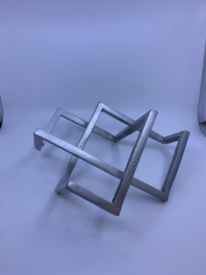 SILVER ABSTRACT SHAPED DESK DECOR.