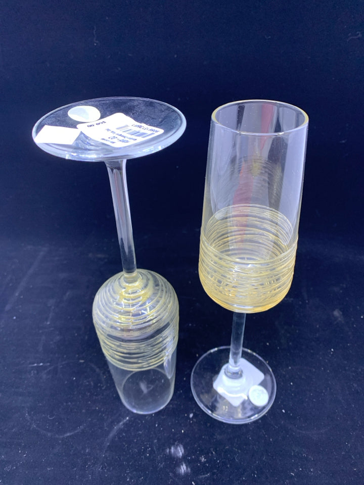 2 NEW MARIPOSA CHAMPAGNE GLASSES WITH GOLD SWIRLS.