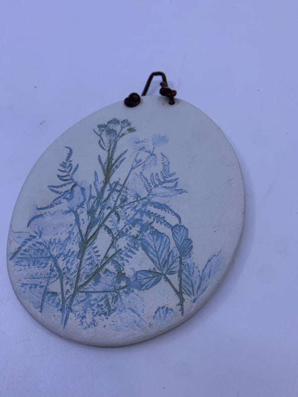 BLUE AND GREEN WILDFLOWER POTTERY WALL HANGING.