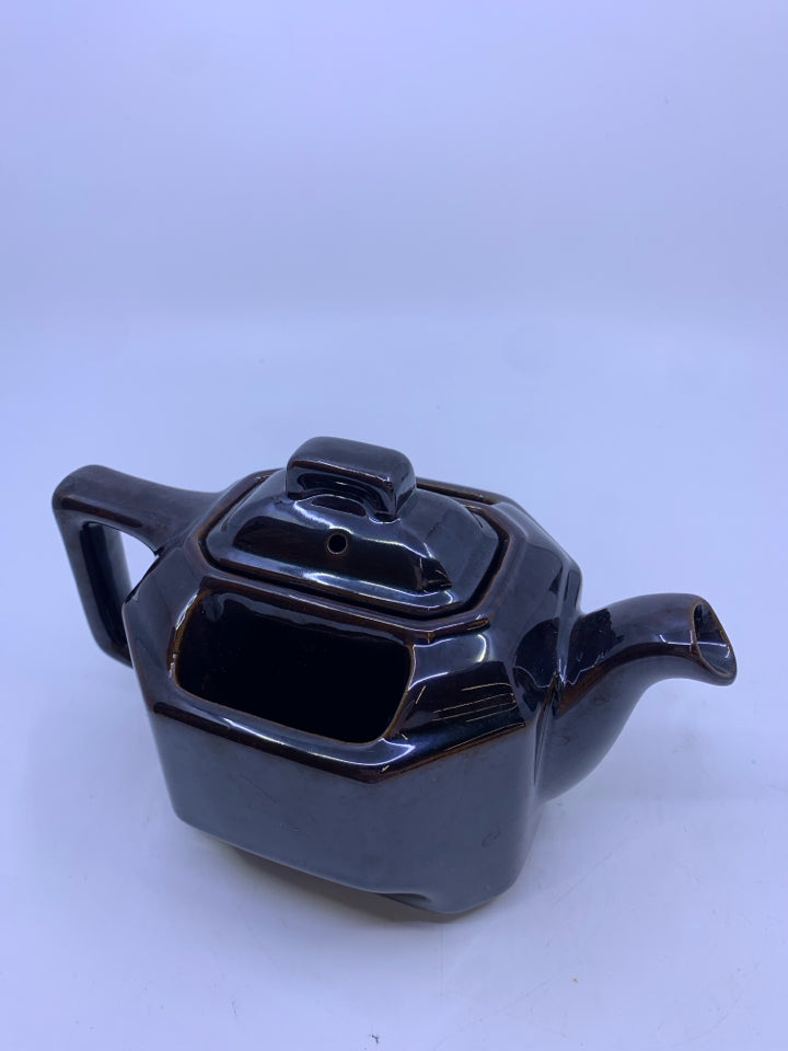 BROWN TEAPOT WITH TEABAG HOLDERS.
