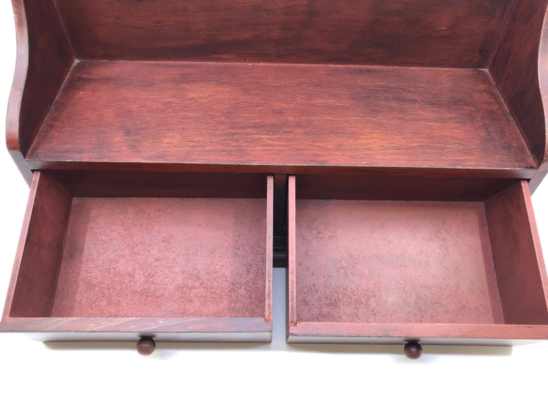 SMALL RED WOOD SHELF WITH 2 DRAWER STORAGE.