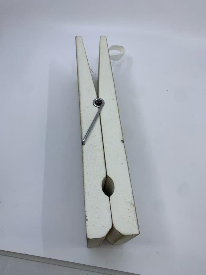 LARGE WHITE WOOD CLOTHES PIN WALL HANGING.