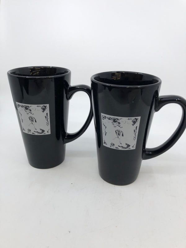 2 TALL BLACK AND WITE CAT MUGS.