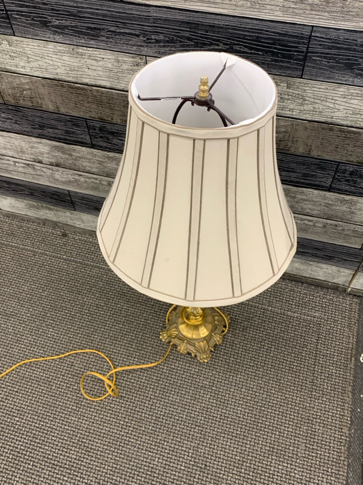 TALL BRASS LAMP WITH GLASS BALL AND TAN/BROWN SHADE.