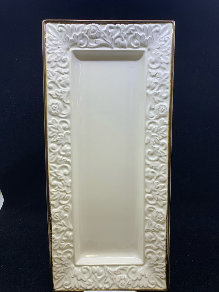 CREAM SCROLL SERVING TRAY WITH BROWN RIM.