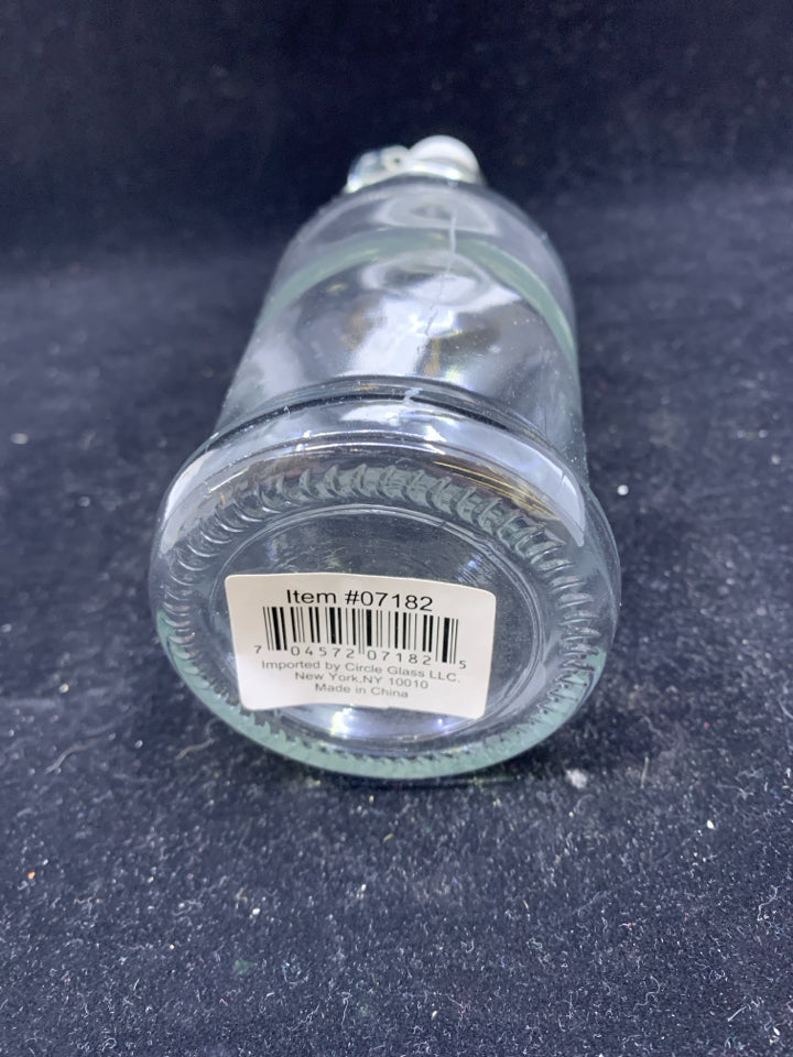 GLASS BOTTLE WITH WHITE FLIP TOP.