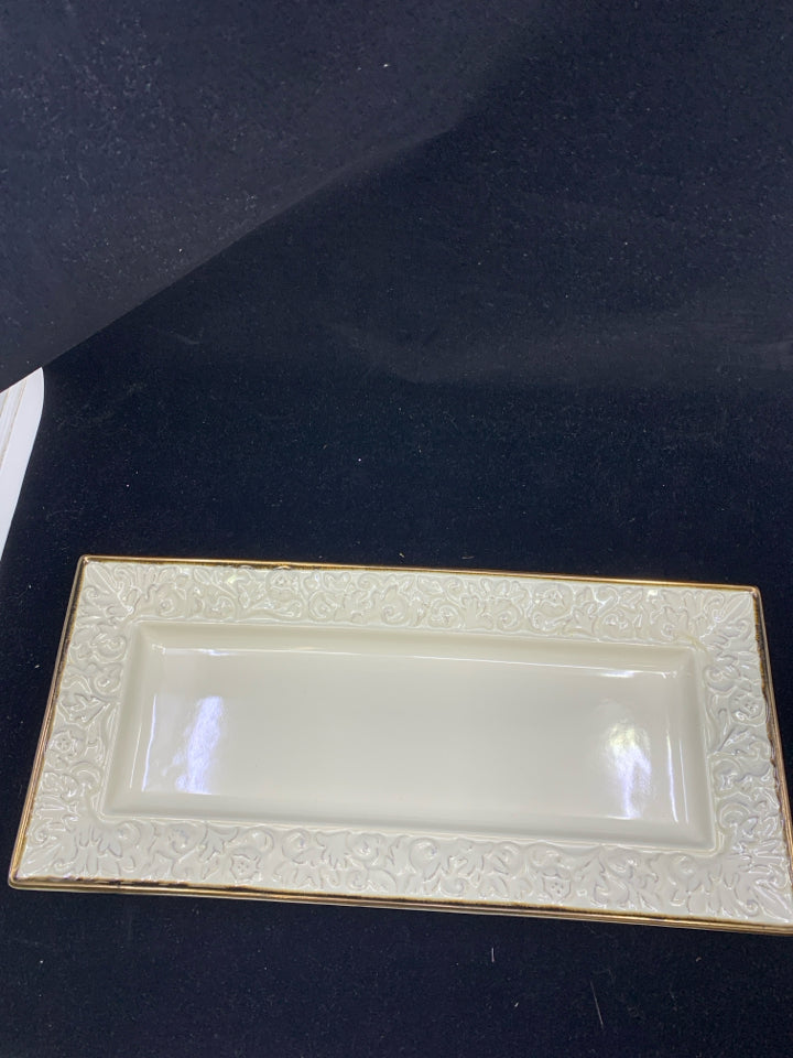 CREAM SCROLL SERVING TRAY WITH BROWN RIM.
