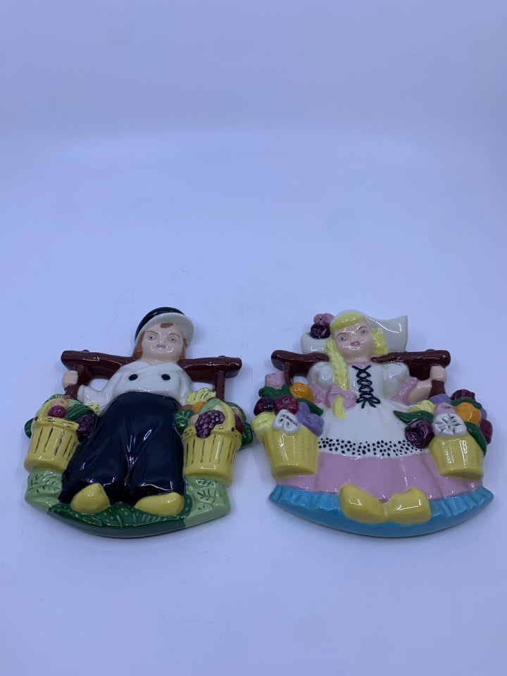 2 HEAVY CERAMIC DUTCH BOY AND GIRL WALL HANGING FIGURES.