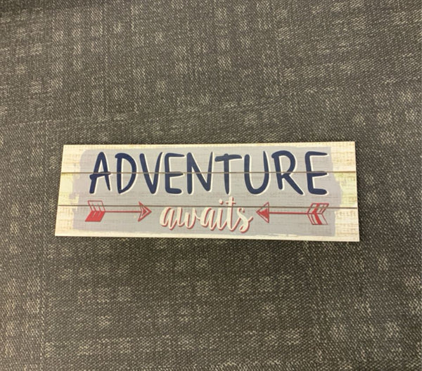 "ADVENTURE AWAITS" DISTRESSED WOOD WALL HANGING.