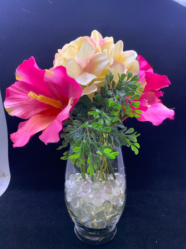 GLASS VASE WITH LARGE PINK AND CREAM FLOWERS.