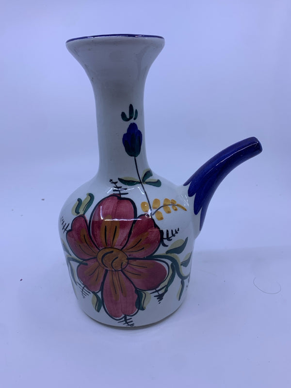 COLORFUL DECANTER W/ PINK FLOWER.