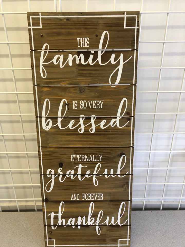 "THIS FAMILY" WHITE/WOOD WALL HANGING.