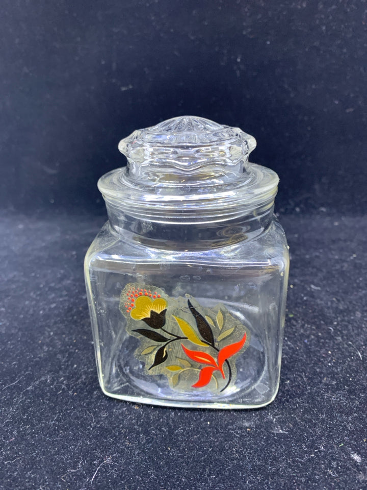 SMALL GLASS CANISTER W/ FLOWER.
