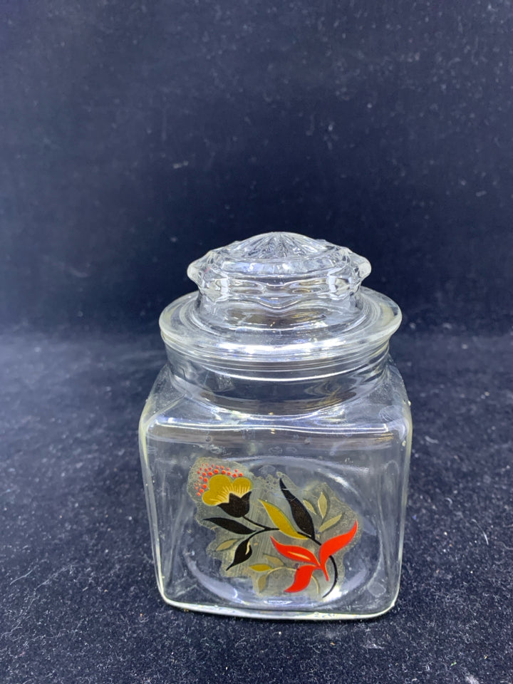 SMALL GLASS CANISTER W/ FLOWER.