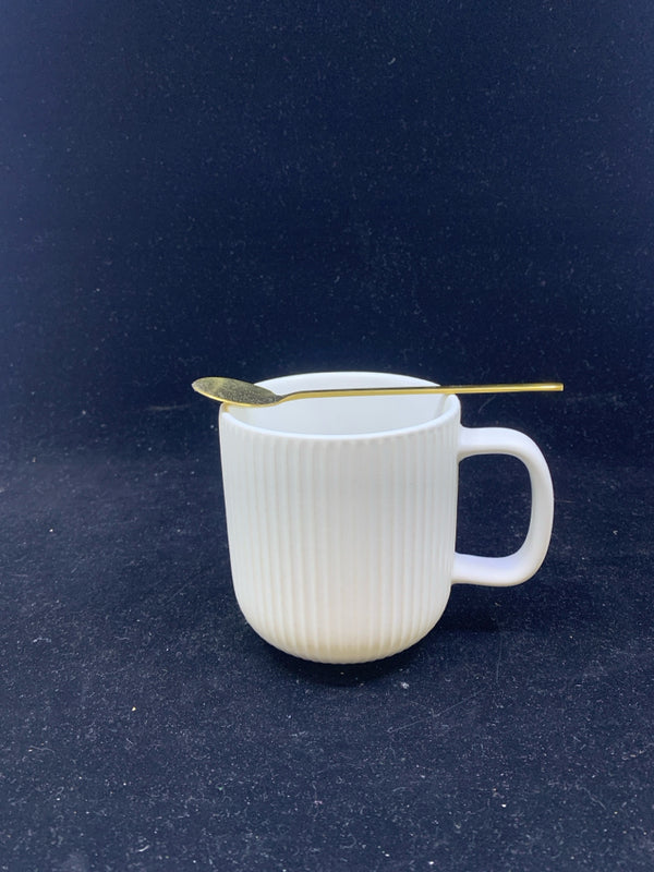 WHITE RIBBED MUG WITH GOLD SPOON.